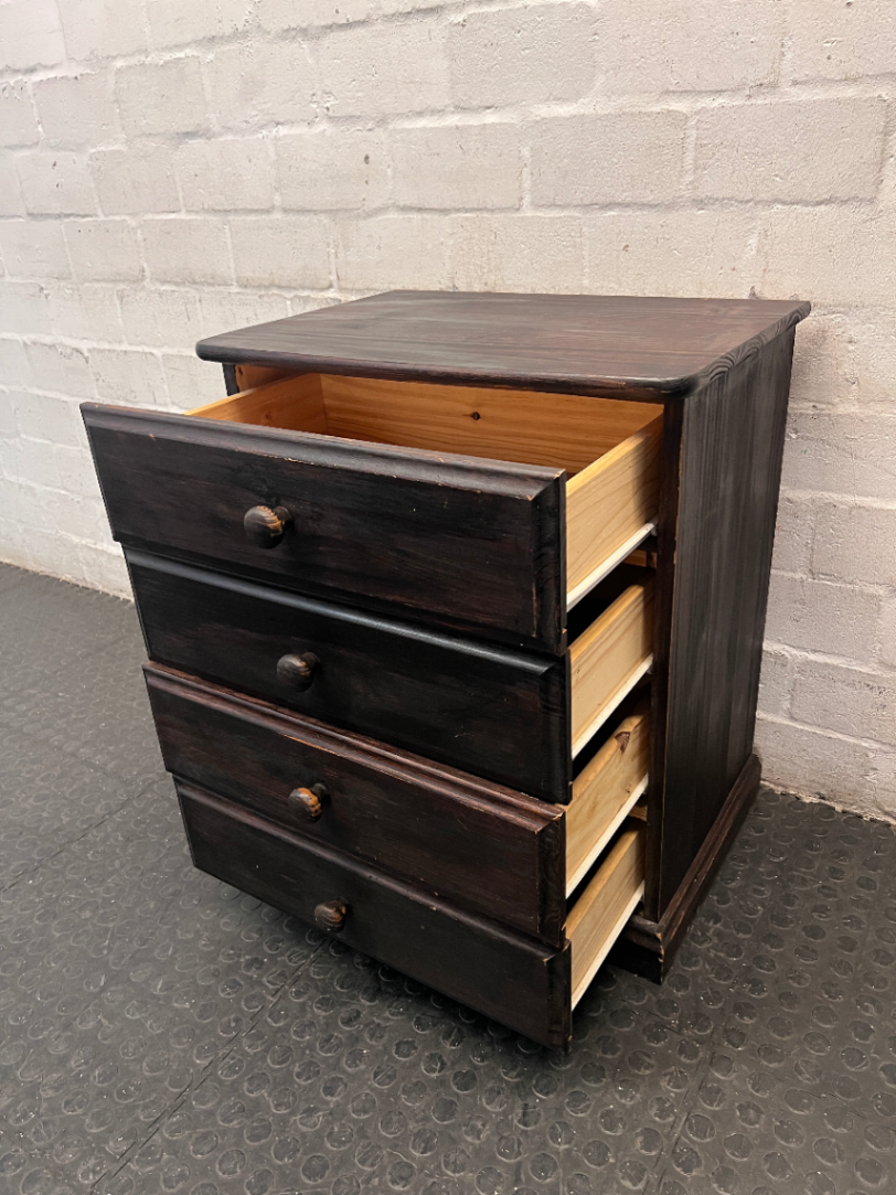 Dark Stained Wooden 4-Drawer Chest — Visible Wear and Surface Marks