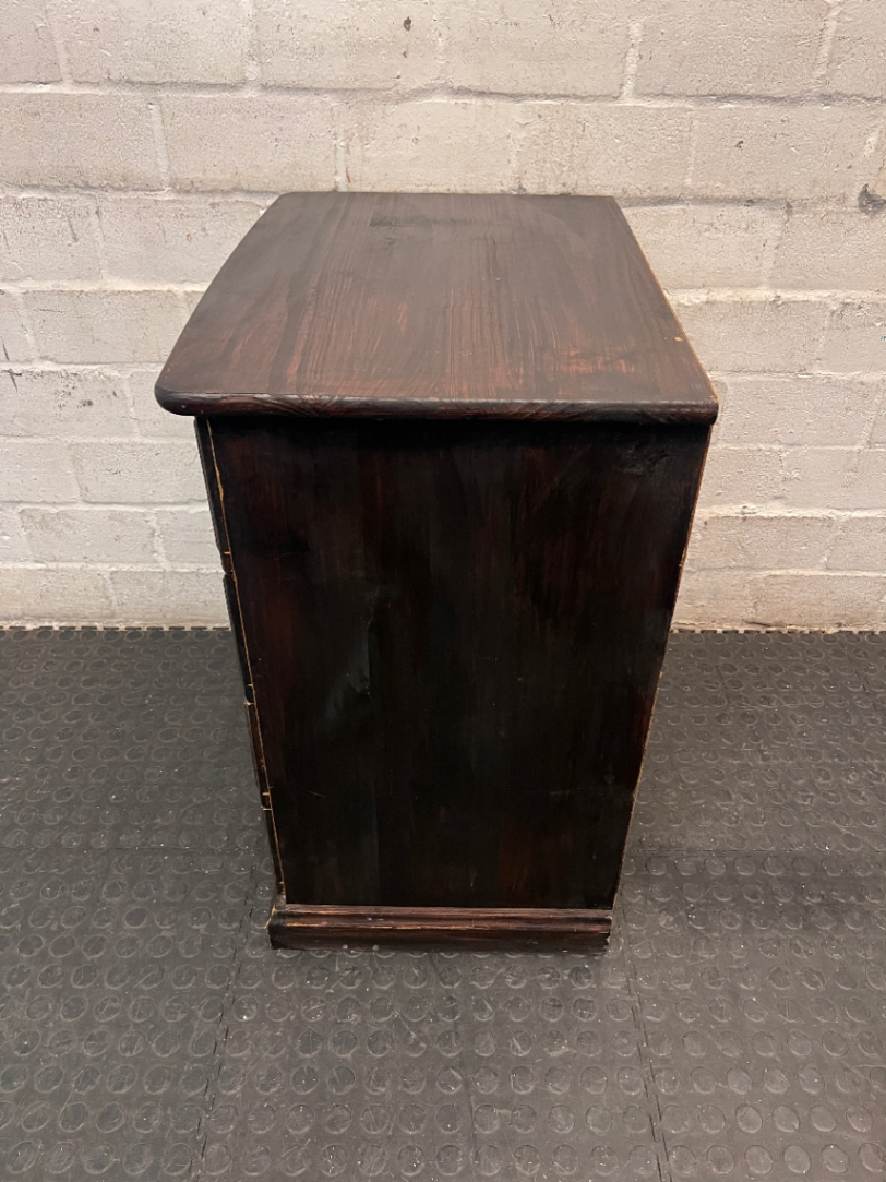 Dark Stained Wooden 4-Drawer Chest — Visible Wear and Surface Marks