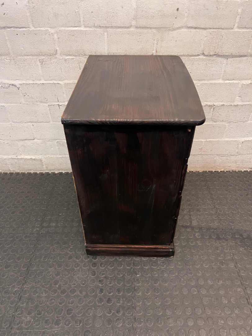Dark Stained Wooden 4-Drawer Chest — Visible Wear and Surface Marks