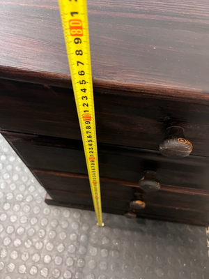 Dark Stained Wooden 4-Drawer Chest — Visible Wear and Surface Marks