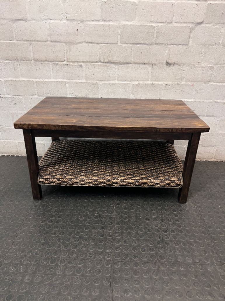 Dark Wood Coffee Table with Woven Storage Shelf — Used; Fair condition