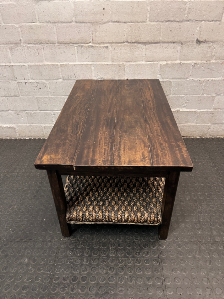 Dark Wood Coffee Table with Woven Storage Shelf — Used; Fair condition