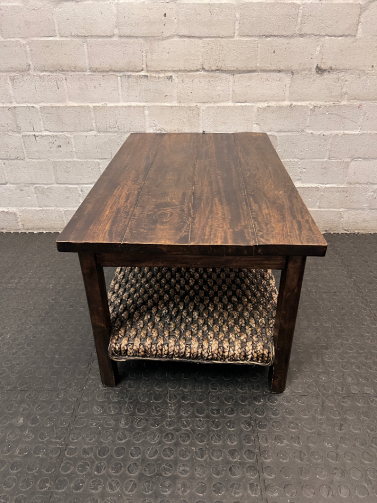 Dark Wood Coffee Table with Woven Storage Shelf — Used; Fair condition