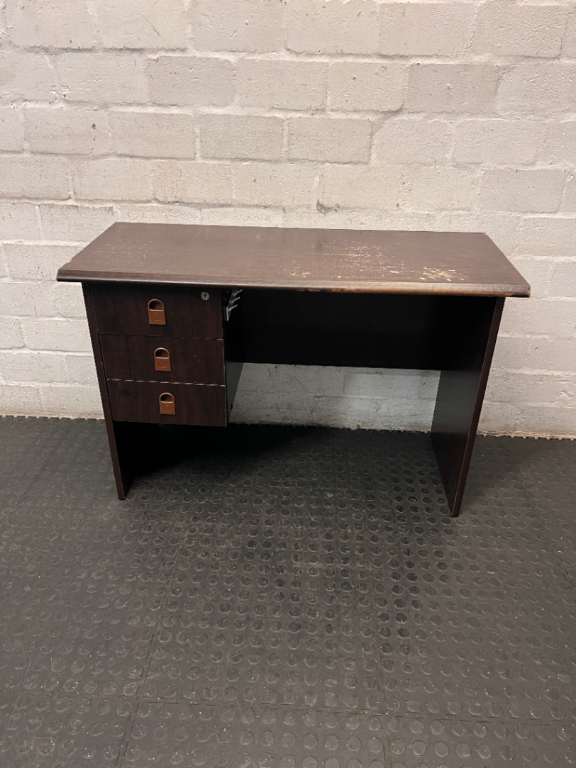 Dark Wood-Look Office Desk with Three Drawers — Poor Condition with Surface Wear