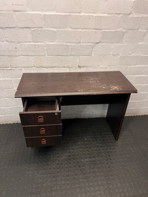 Dark Wood-Look Office Desk with Three Drawers — Poor Condition with Surface Wear