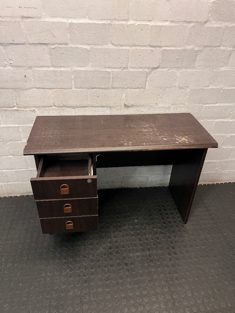 Dark Wood-Look Office Desk with Three Drawers — Poor Condition with Surface Wear