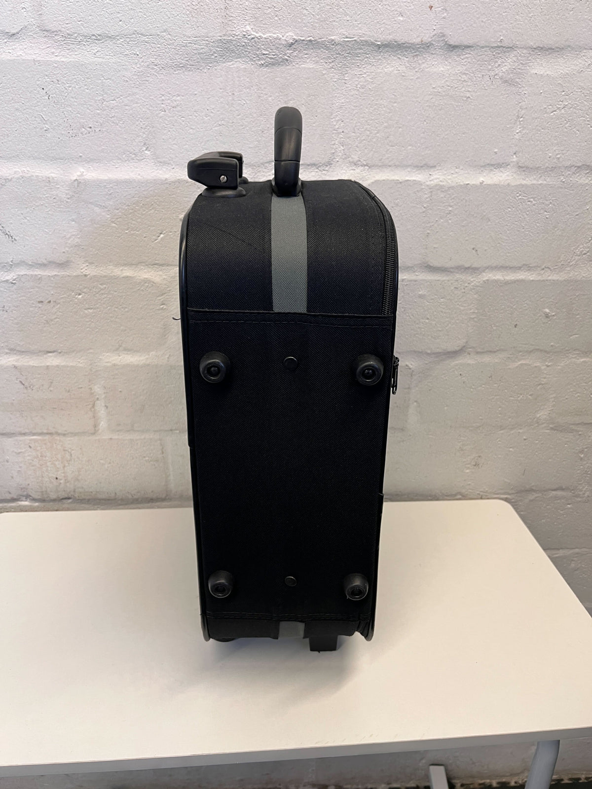 Elegant Black Rolling Travel Suitcase with Minor Wear
