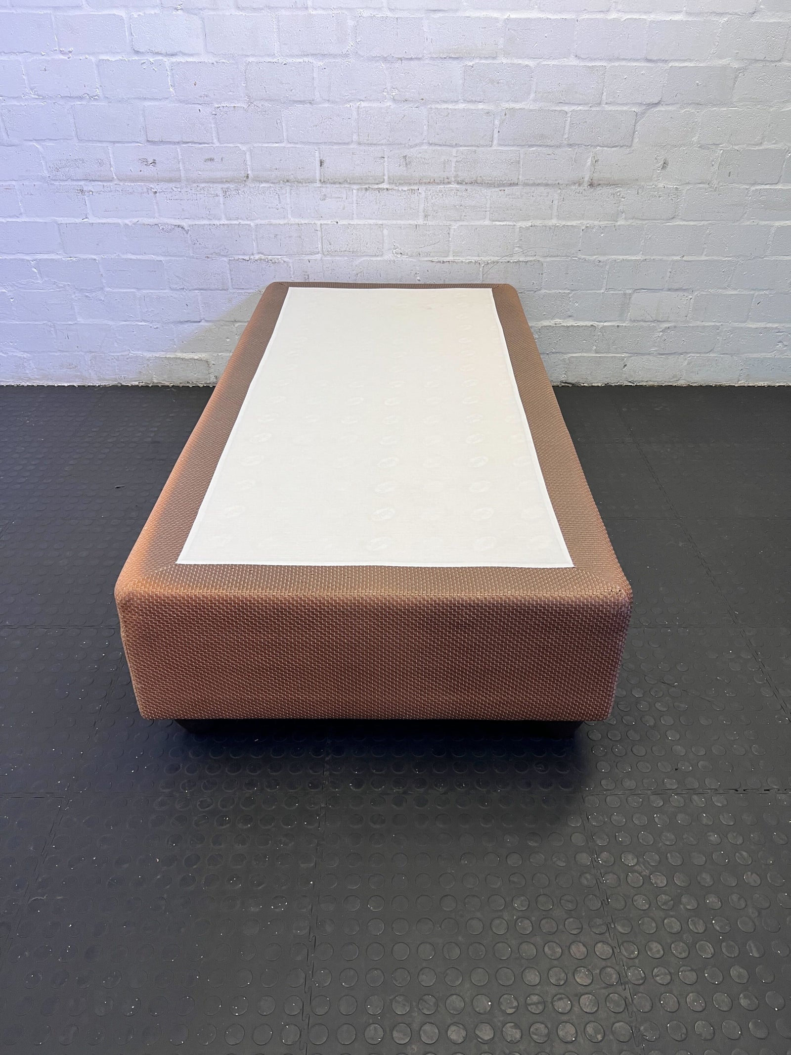 Elegant Brown Upholstered Bed Base with Minor Wear