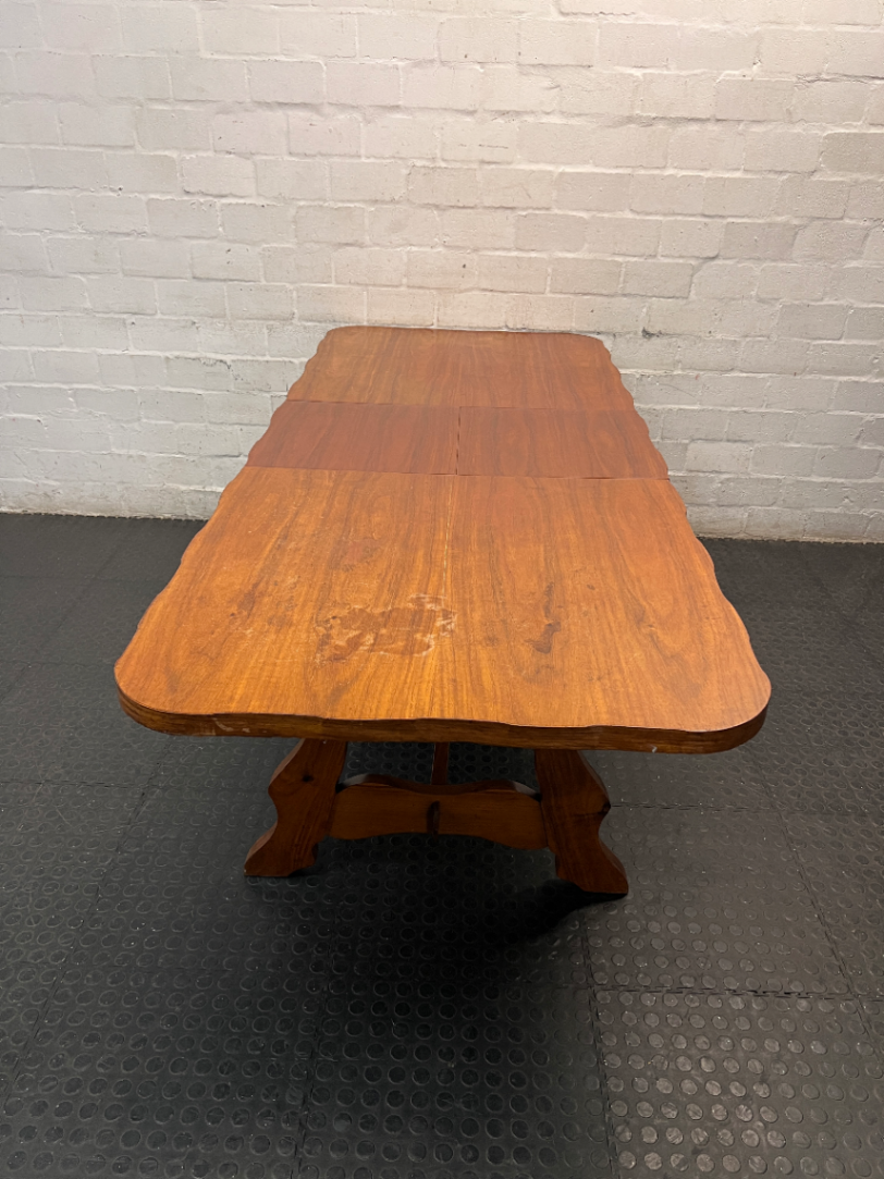 Extendable Wooden Trestle Dining Table — Visible Marks and Wear on Table Top