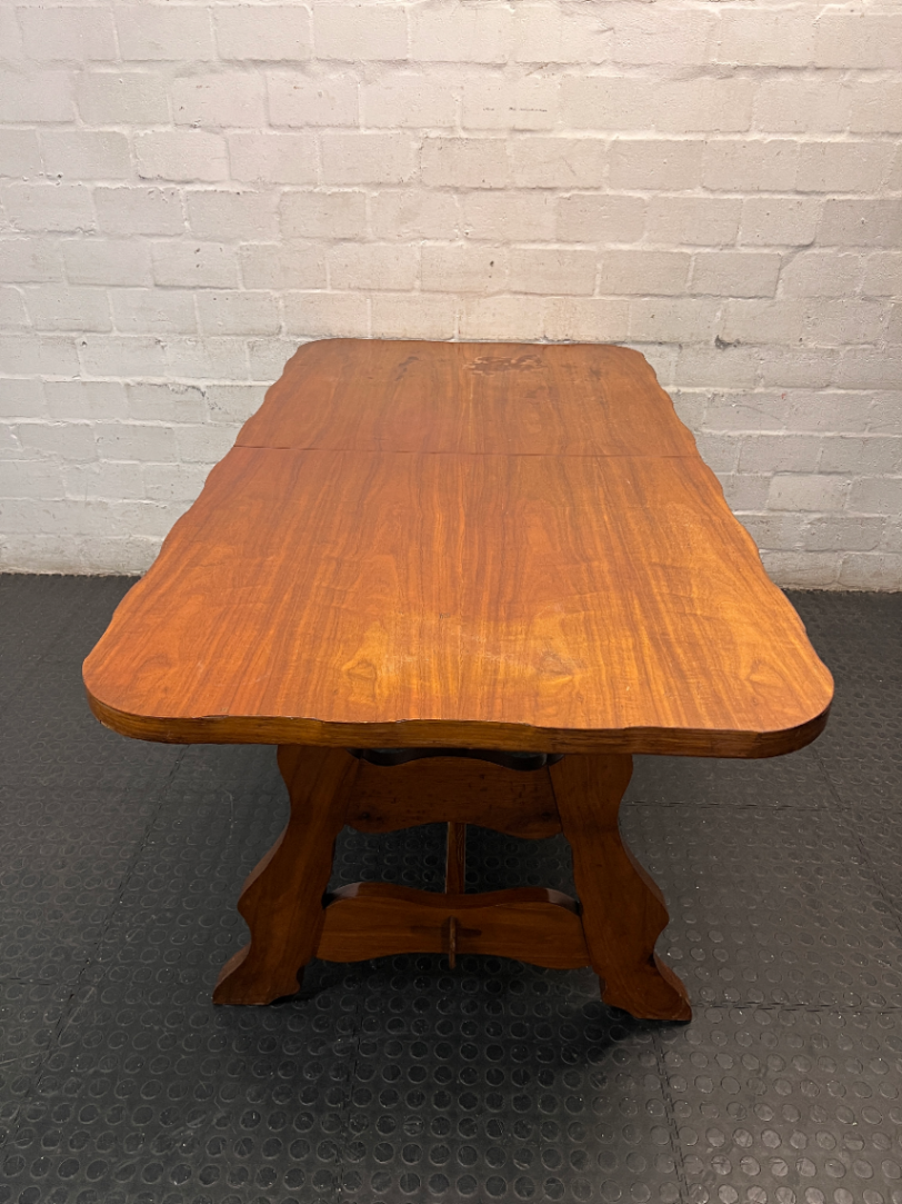 Extendable Wooden Trestle Dining Table — Visible Marks and Wear on Table Top