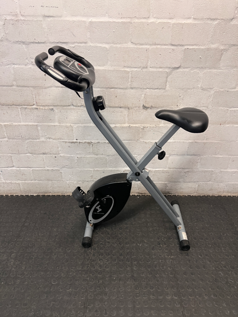 Grey and Black X-Frame Stationary Exercise Bike — Fair Used Condition