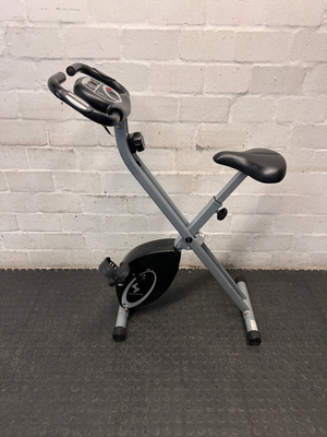 Grey and Black X-Frame Stationary Exercise Bike — Fair Used Condition