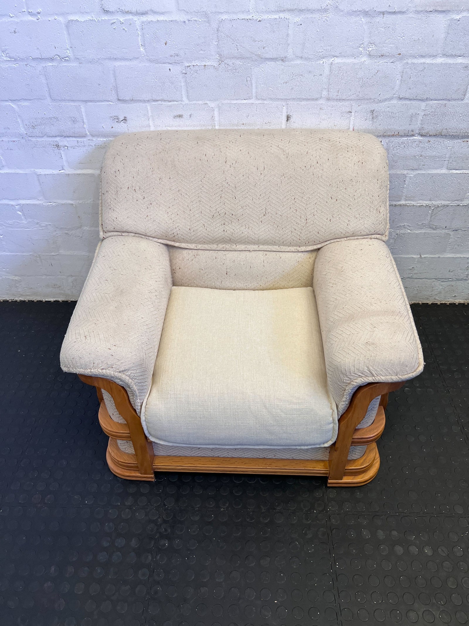 Cozy Beige Armchair with Rustic Wooden Frame – Minor Stains