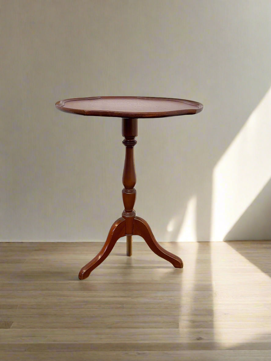 Elegant Round Mahogany Side Table with Minor Wear