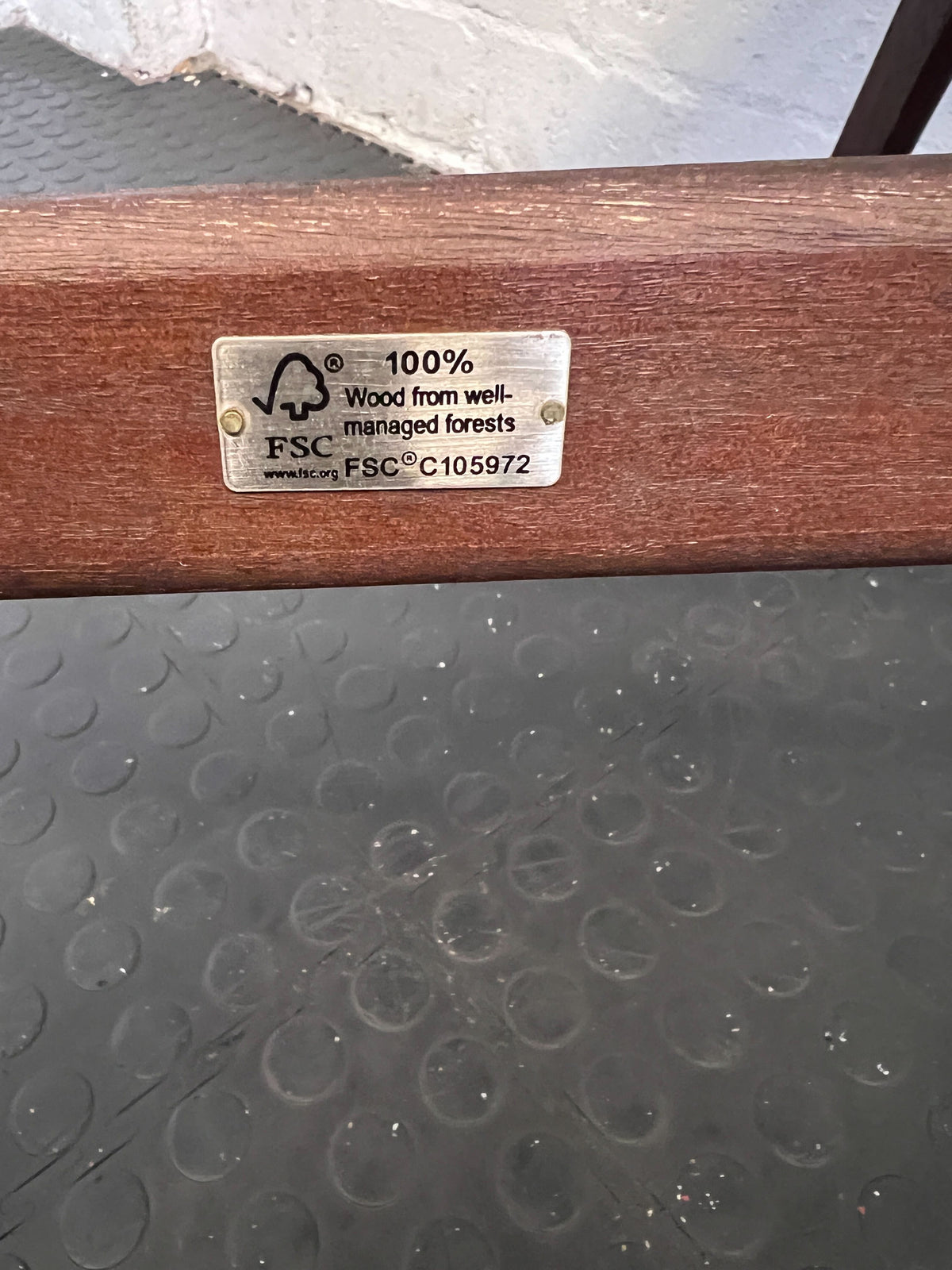 Wooden product with FSC certification label on a textured surface