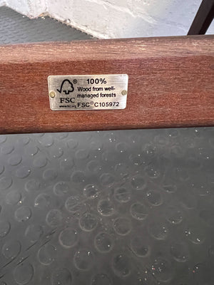 Wooden product with FSC certification label on a textured surface
