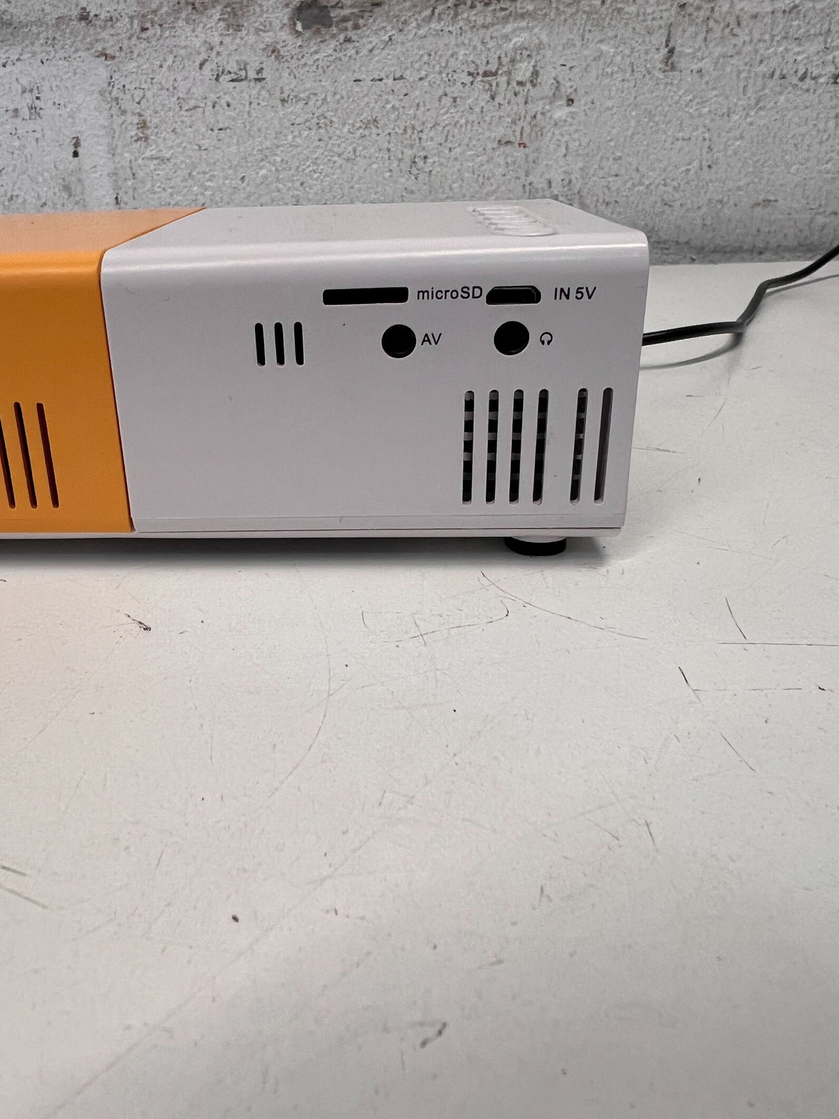 Compact Portable Projector in White and Orange – Minor Scratches