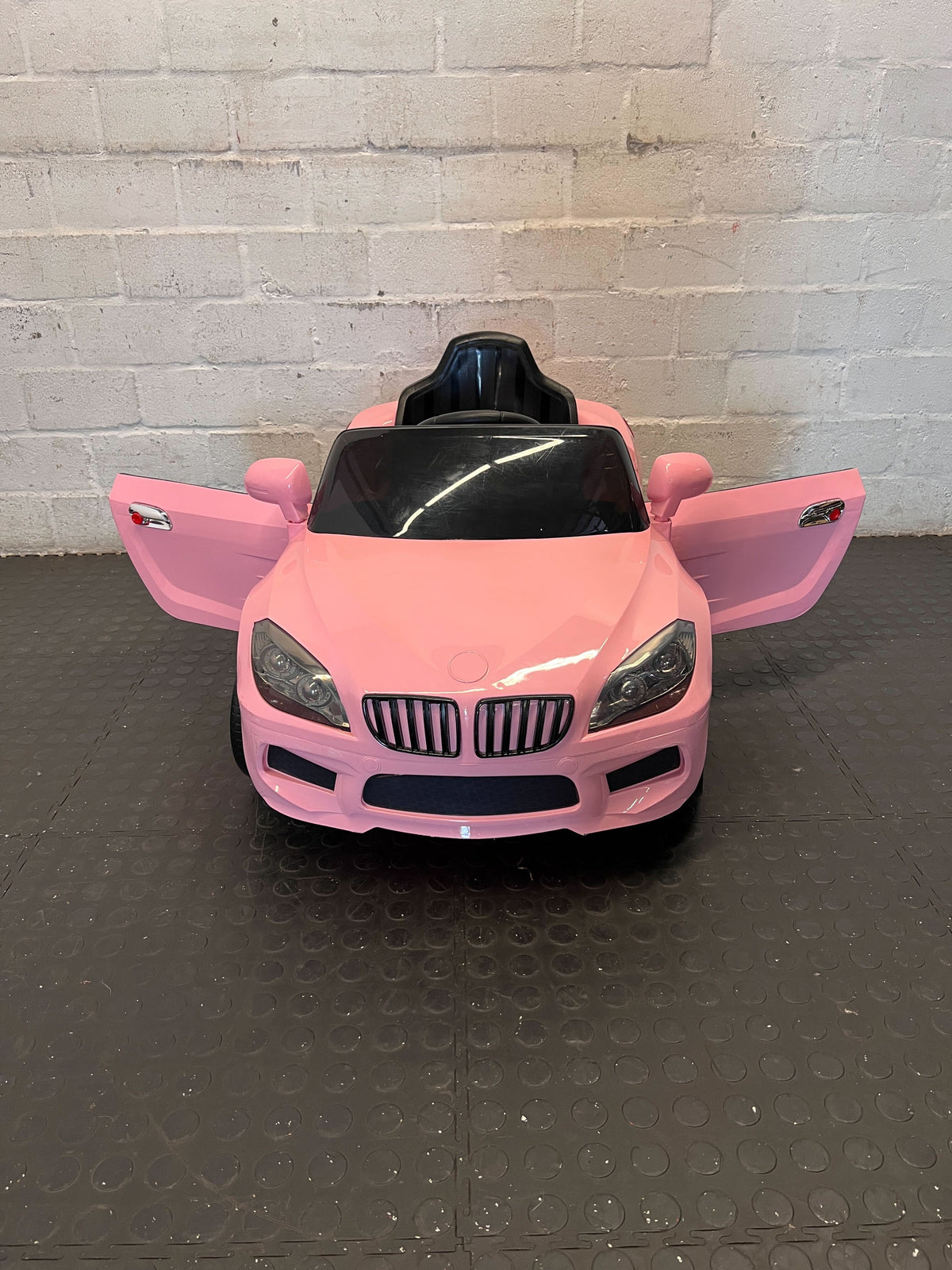 Kids pink electric car  - Pink Kids Electric Ride-On Car Toy - Has no charger - 2ndhandwarehouse.com