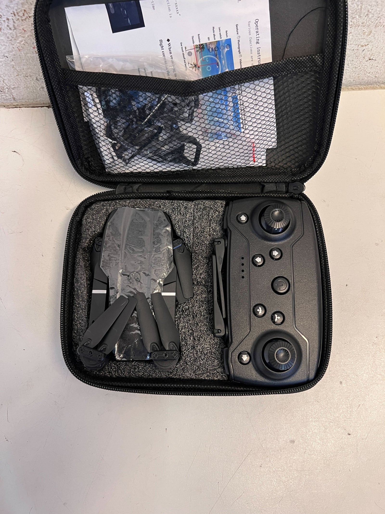 Versatile Black Folding Drone with Minor Wear