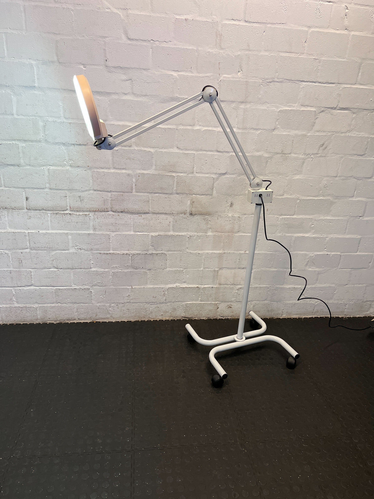 Versatile Adjustable White LED Floor Lamp with Rolling Base