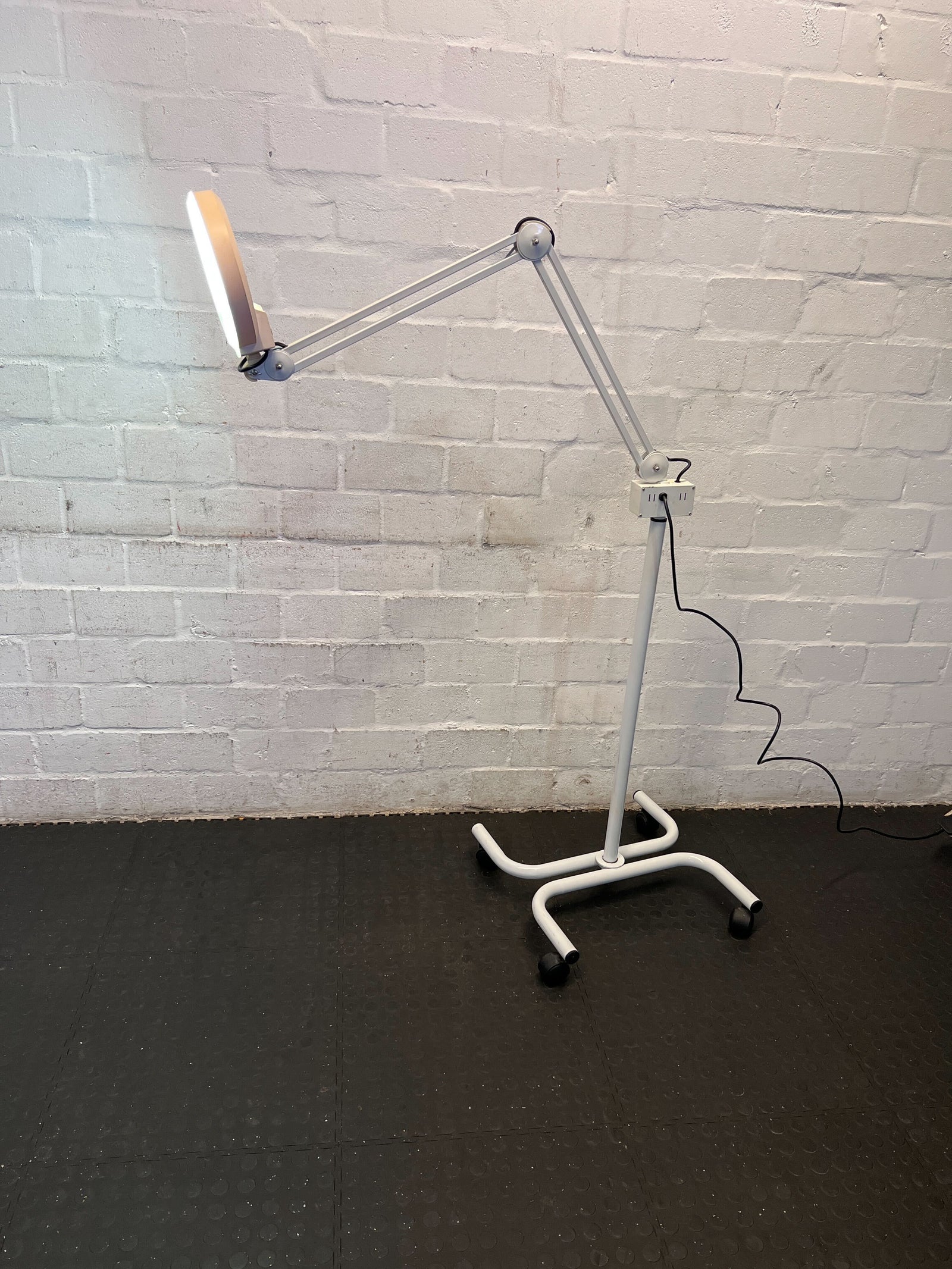 Versatile Adjustable White LED Floor Lamp with Rolling Base