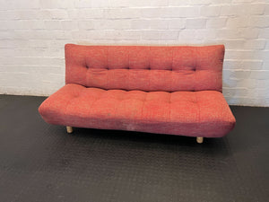Compact Coral Tufted Sofa / sleeper couch slight tear on materiel at the bottom - 2ndhandwarehouse.com