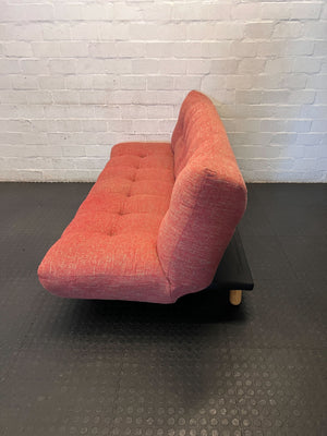 Compact Coral Tufted Sofa / sleeper couch slight tear on materiel at the bottom - 2ndhandwarehouse.com