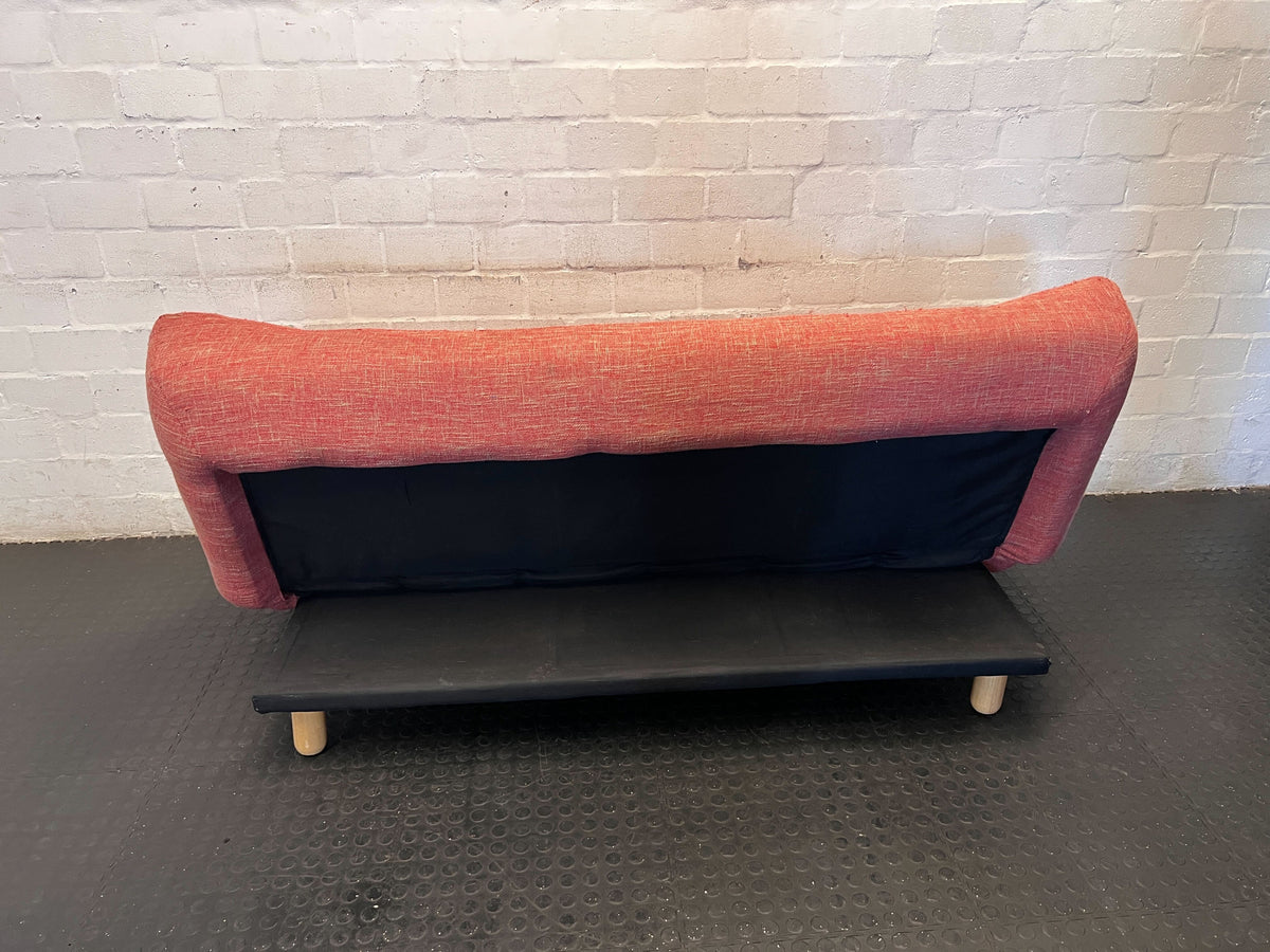 Compact Coral Tufted Sofa / sleeper couch slight tear on materiel at the bottom - 2ndhandwarehouse.com