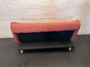 Compact Coral Tufted Sofa / sleeper couch slight tear on materiel at the bottom - 2ndhandwarehouse.com
