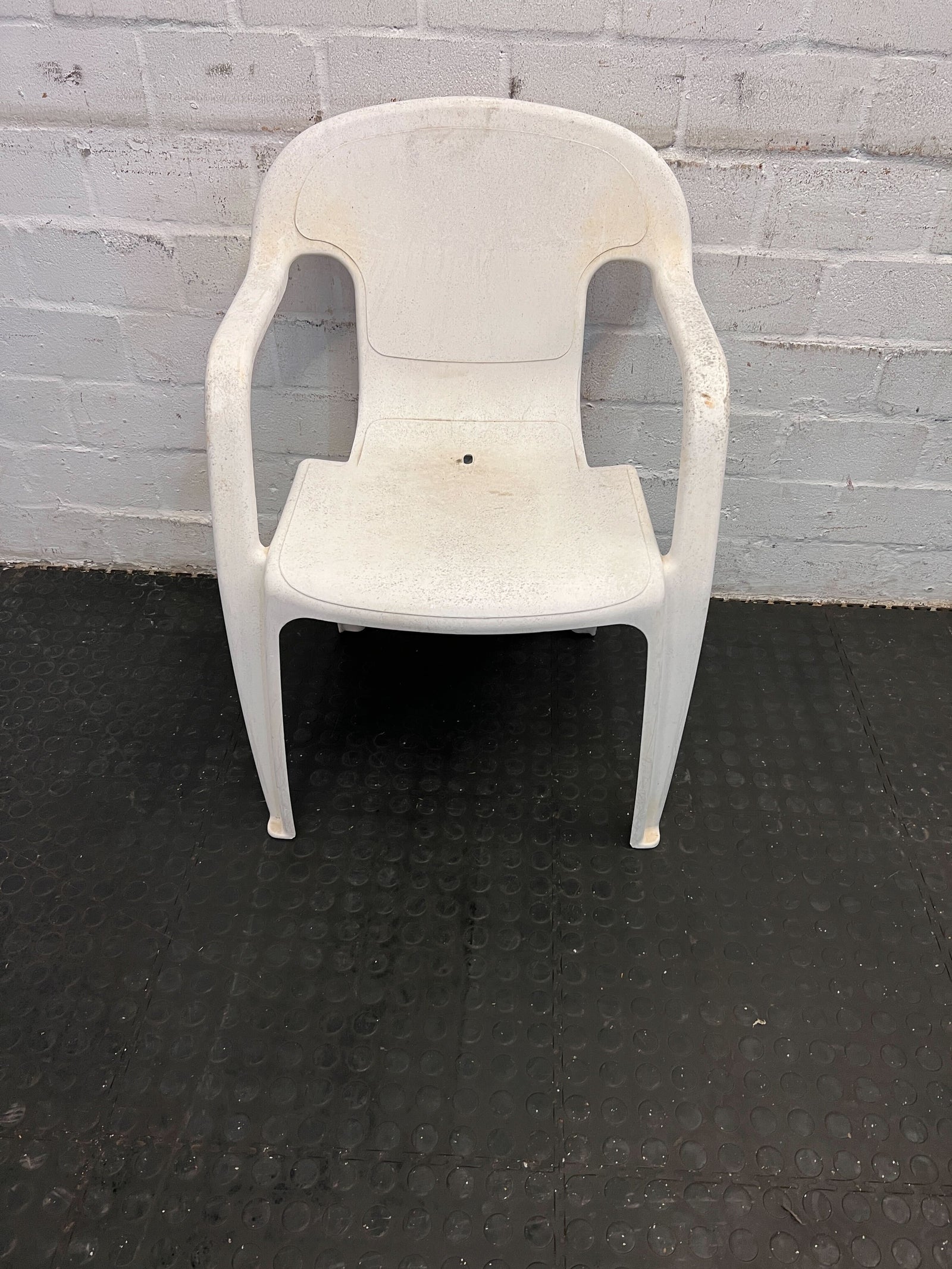 Sturdy White Plastic Outdoor Chair with Minor Wear