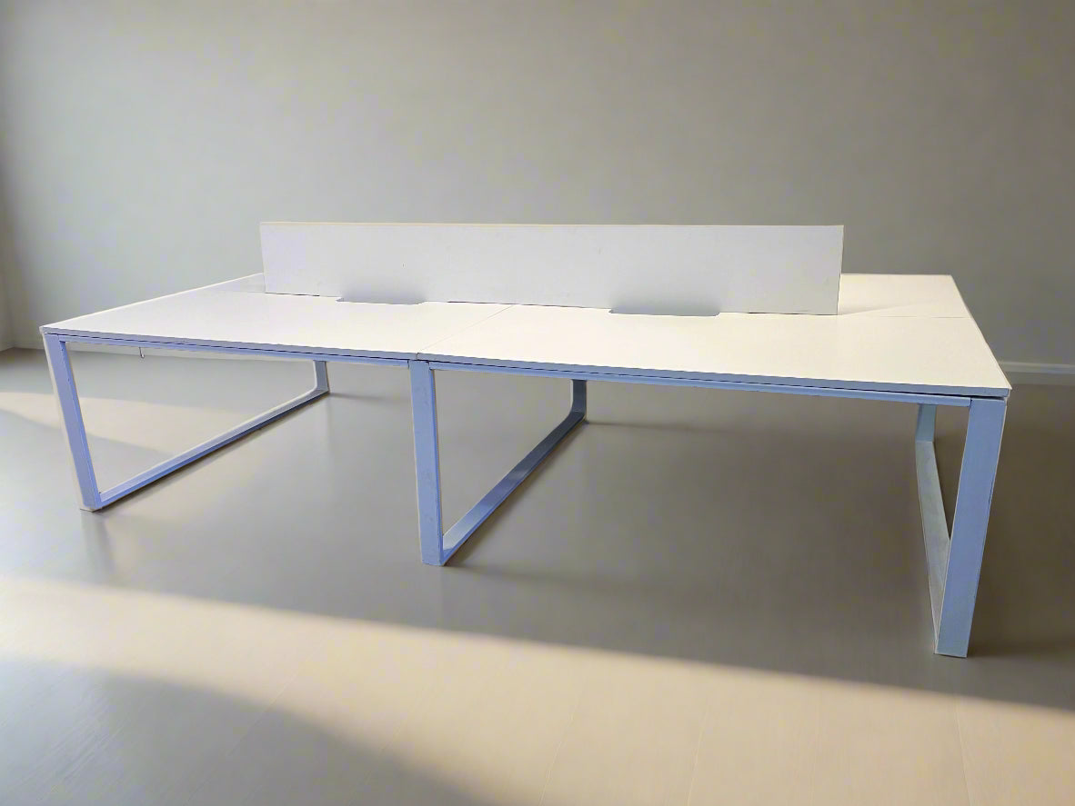 Modern white office desk with integrated partition and metal frame, showing minor surface scratches, photographed in a studio setting.