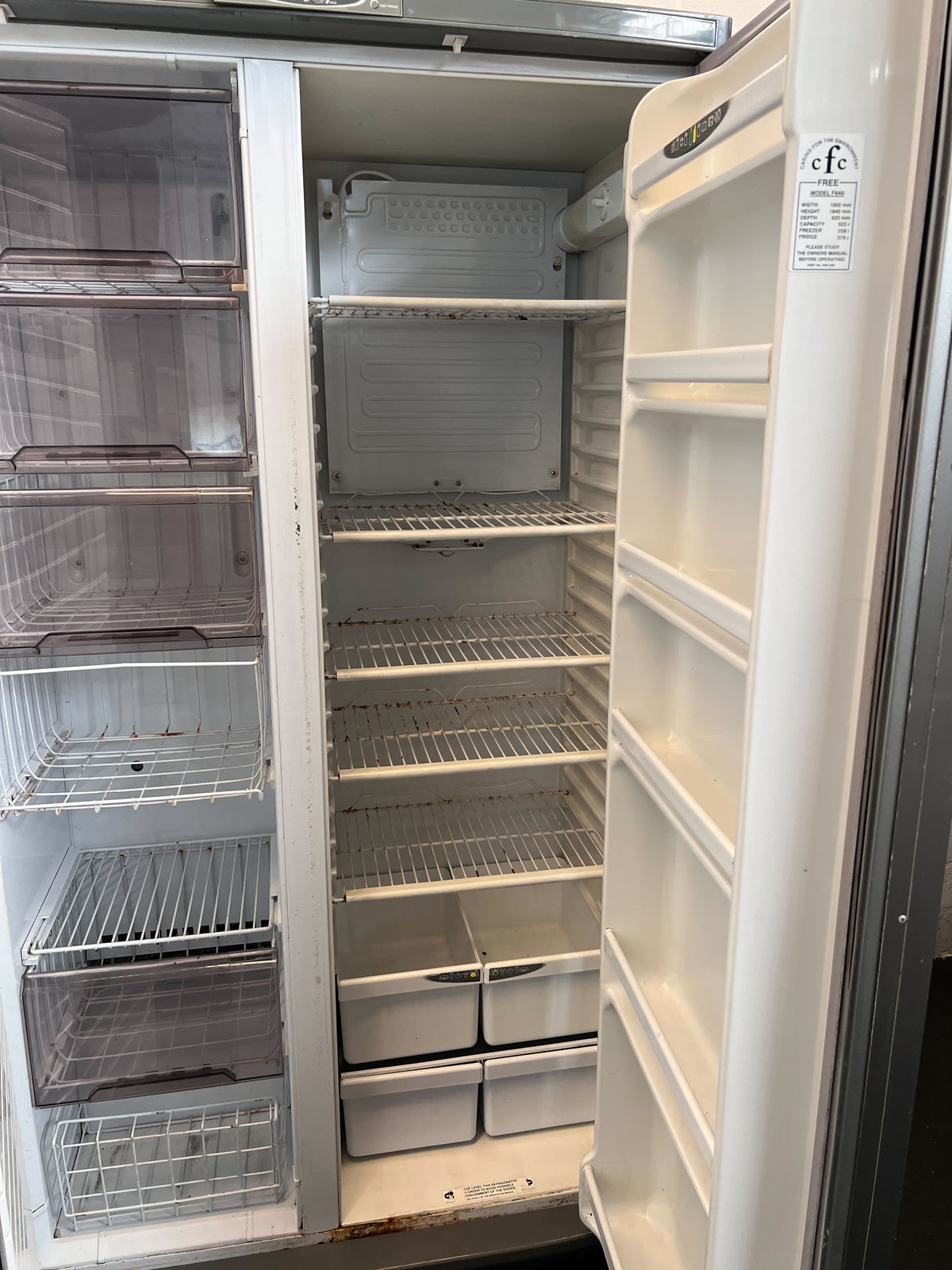 Sleek Silver Double Door Fridge Freezer - Faulty Freezer. Some rusting on the bottom