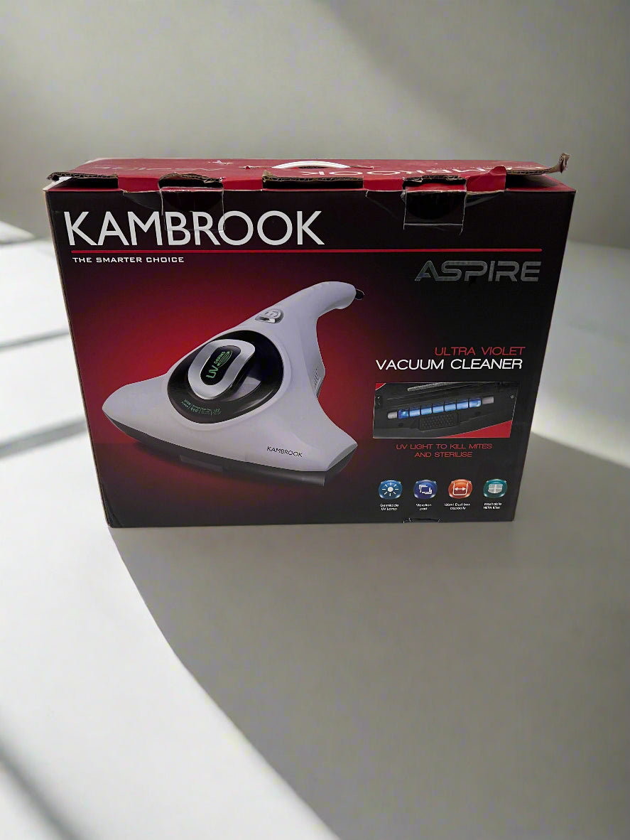 Kambrook vacuum cleaner box on a white floor with gray wall background