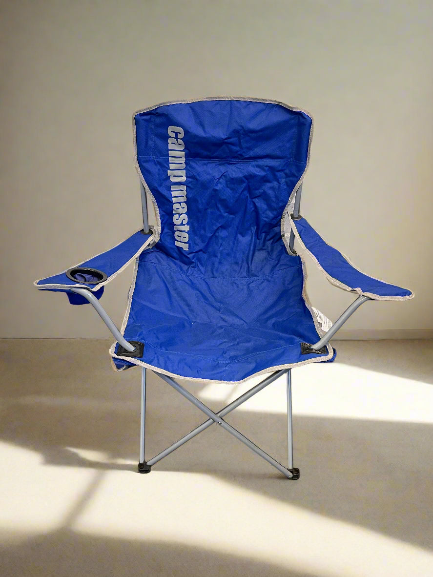 Blue camping chair with 'Camping Master' branding on a beige background