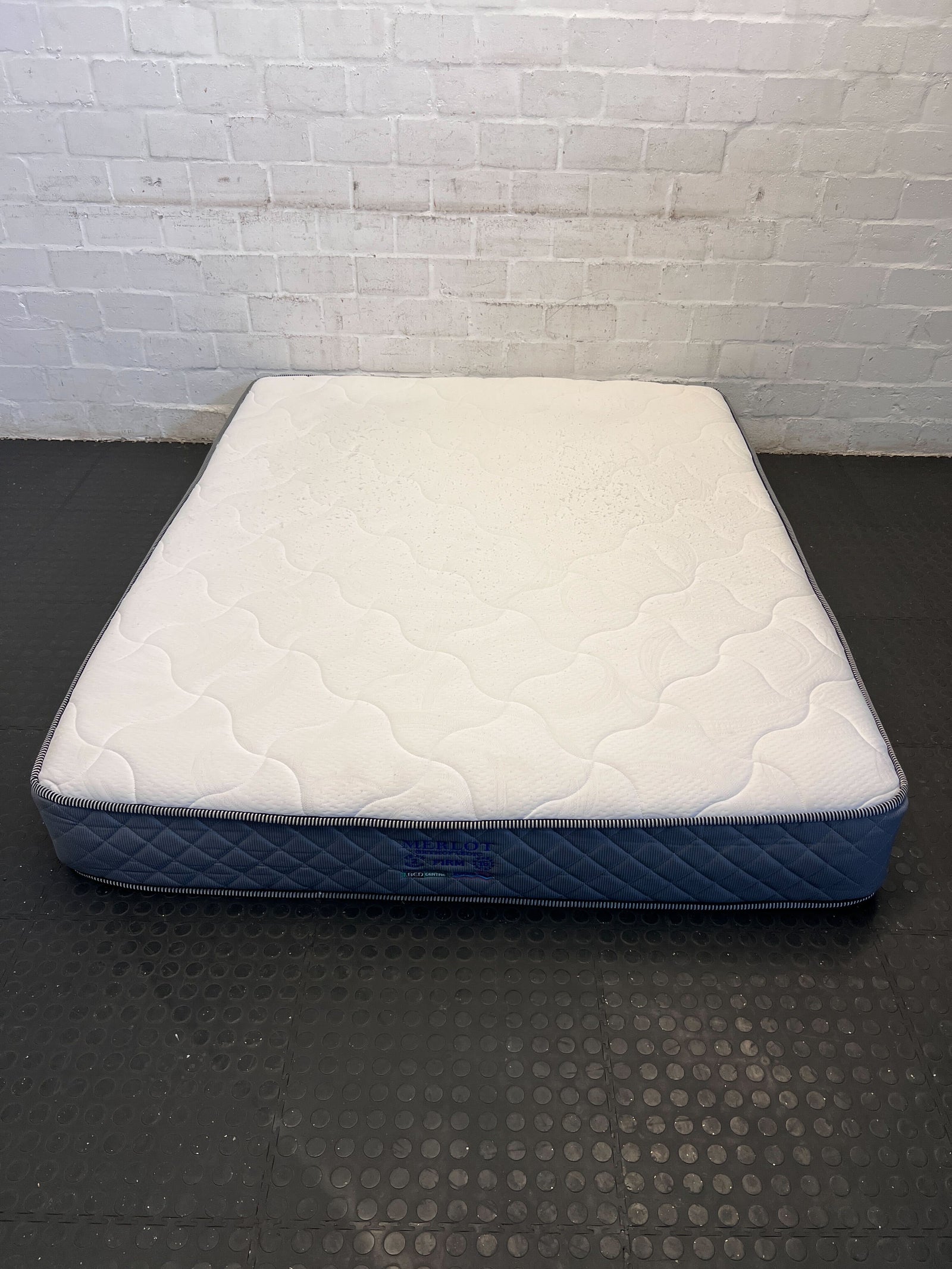 Comfortable Blue and White Twin Mattress – Minor Wear, Great Value!