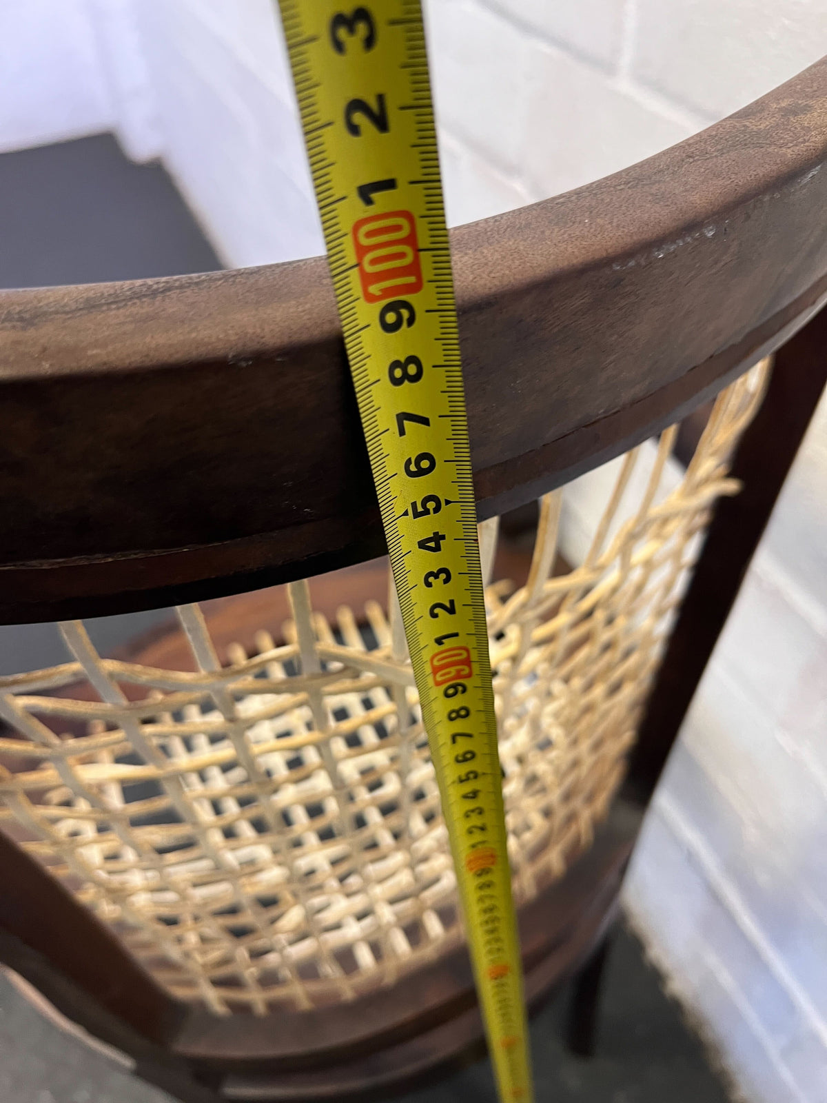 Elegant Vintage Dark Wood Armchair with Woven Seat