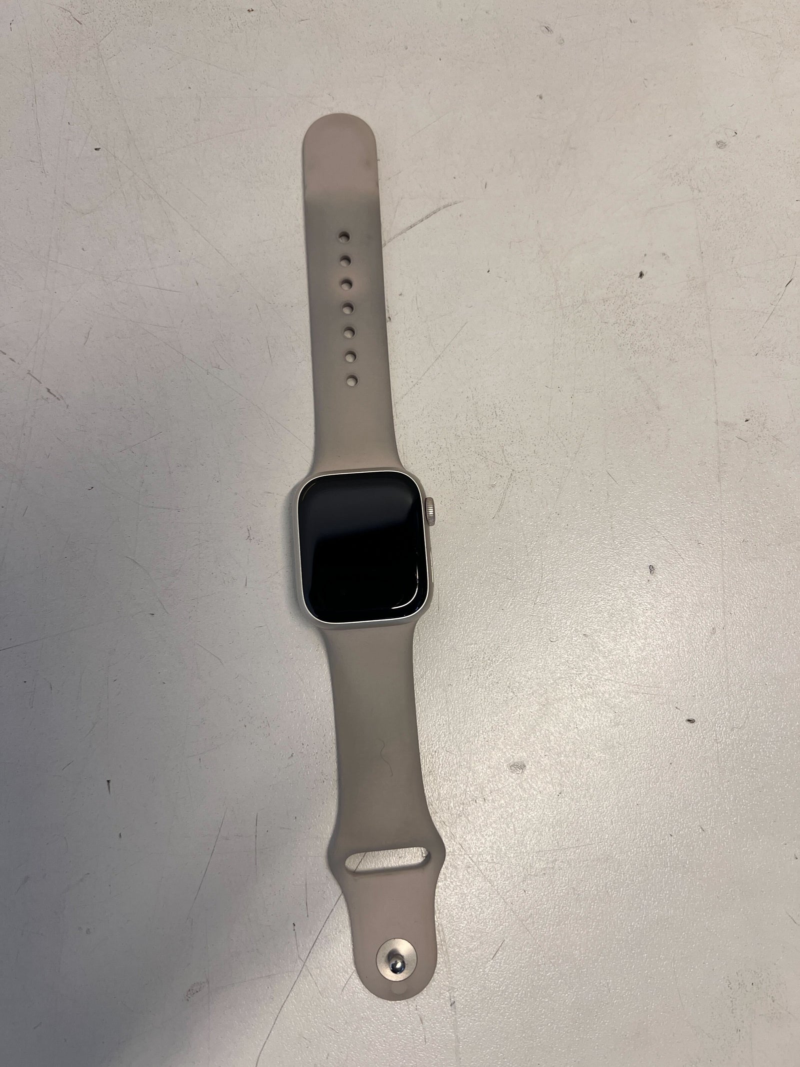 Stylish Silver Apple Watch with Soft Grey Band - Minor Scratches