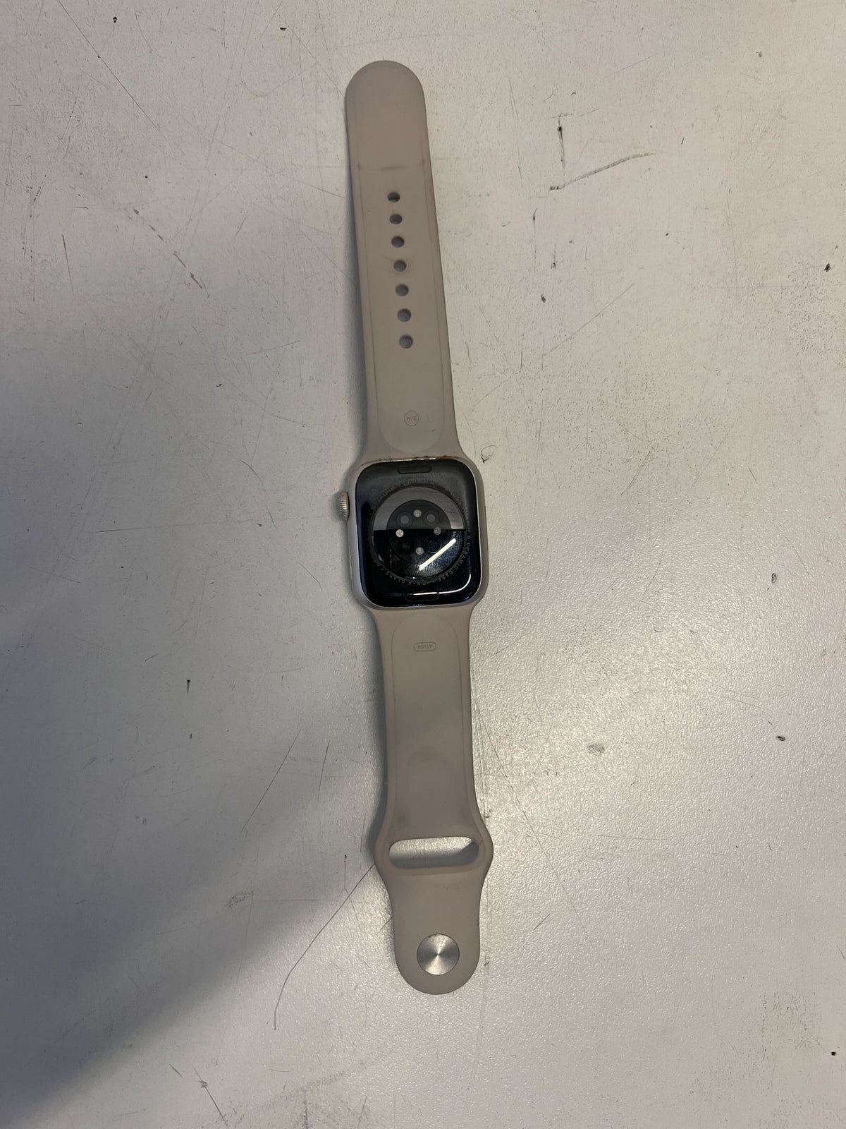 Stylish Silver Apple Watch with Soft Grey Band - Minor Scratches