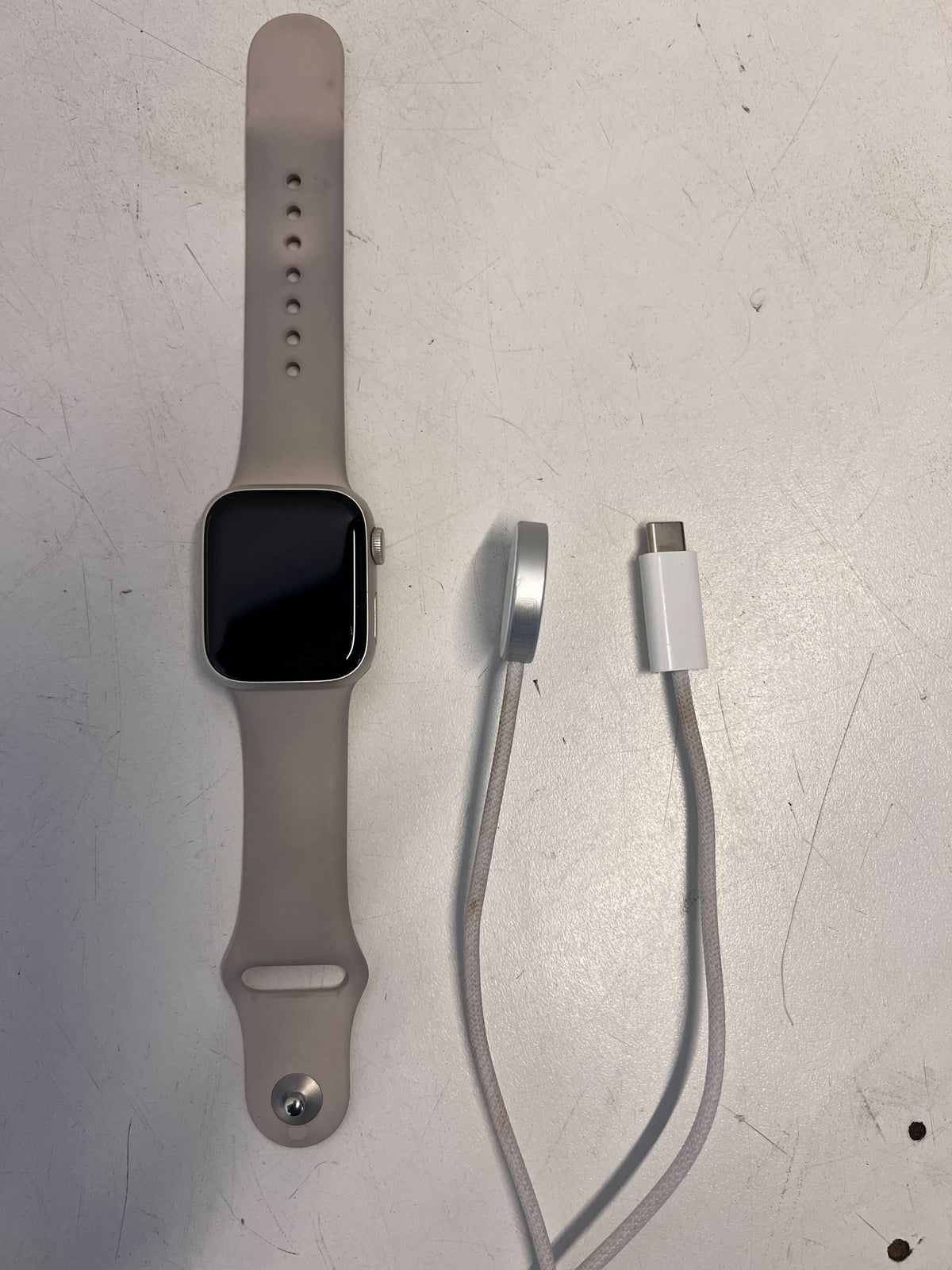 Stylish Silver Apple Watch with Soft Grey Band - Minor Scratches