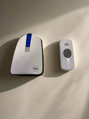 Yale security device on a beige surface