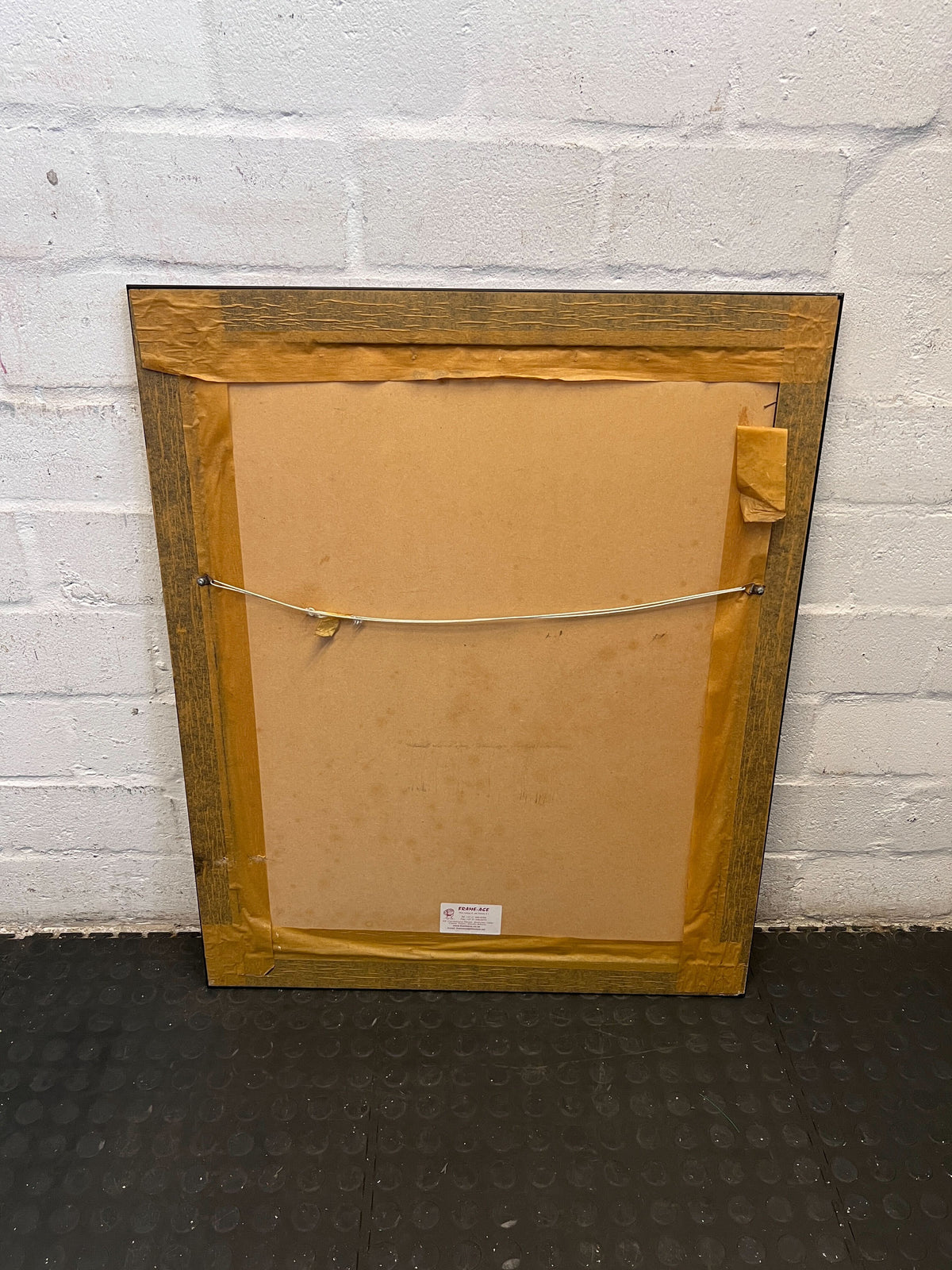 striking framed portrait with maroon matting and dark wood frame