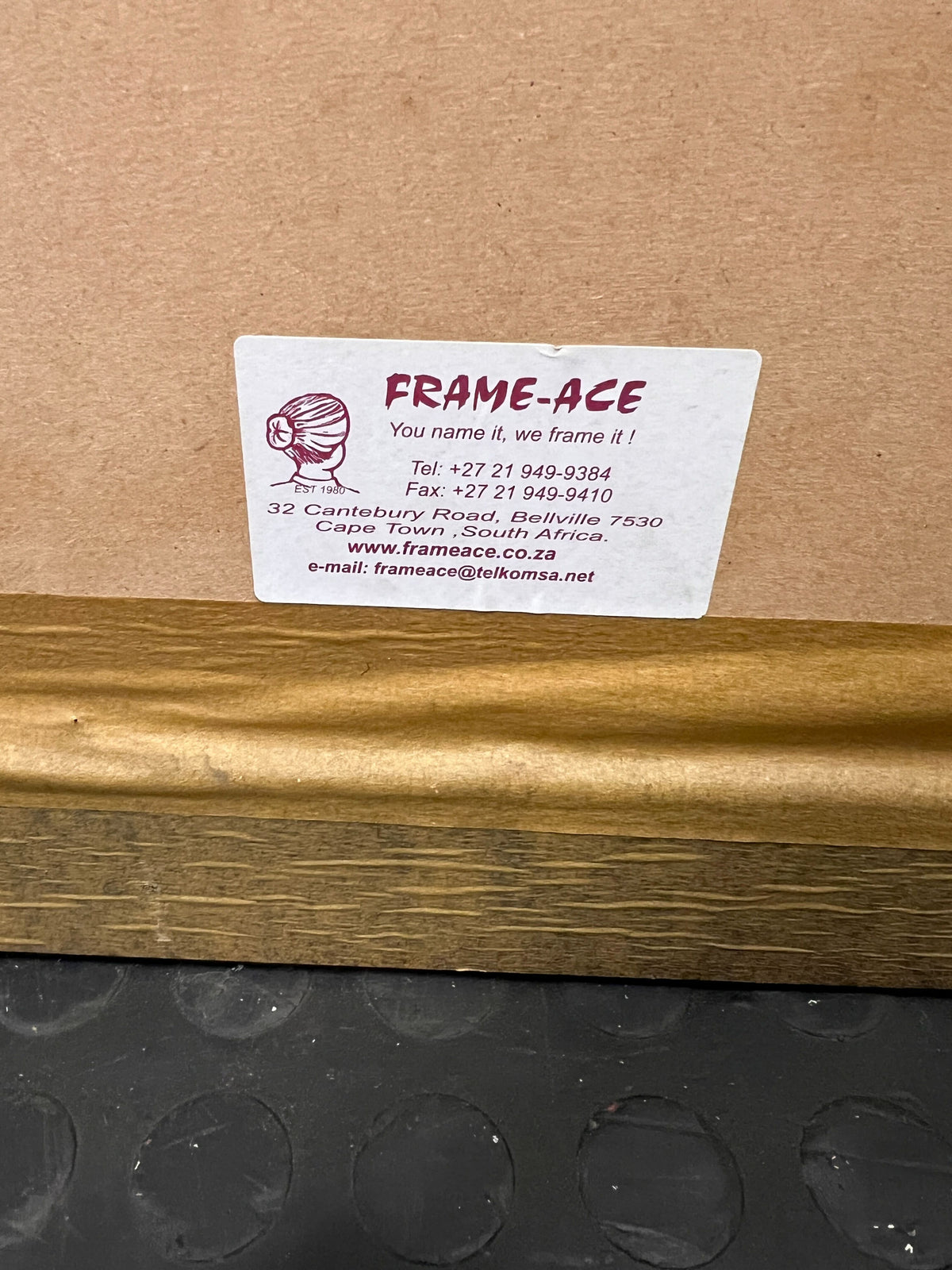 striking framed portrait with maroon matting and dark wood frame