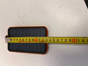 Compact Solar Power Bank with Durable Orange Edge – Excellent Condition