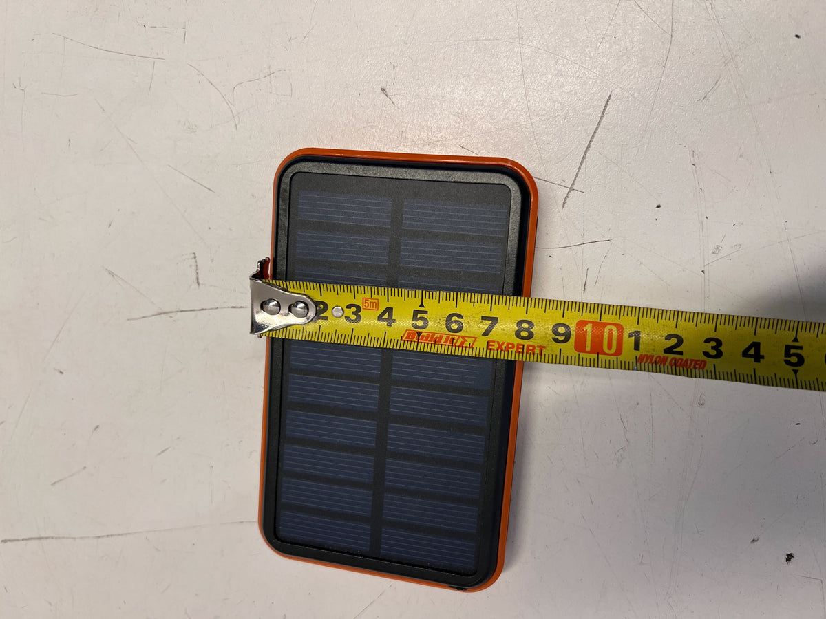 Compact Solar Power Bank with Durable Orange Edge – Excellent Condition