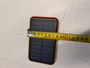 Compact Solar Power Bank with Durable Orange Edge – Excellent Condition