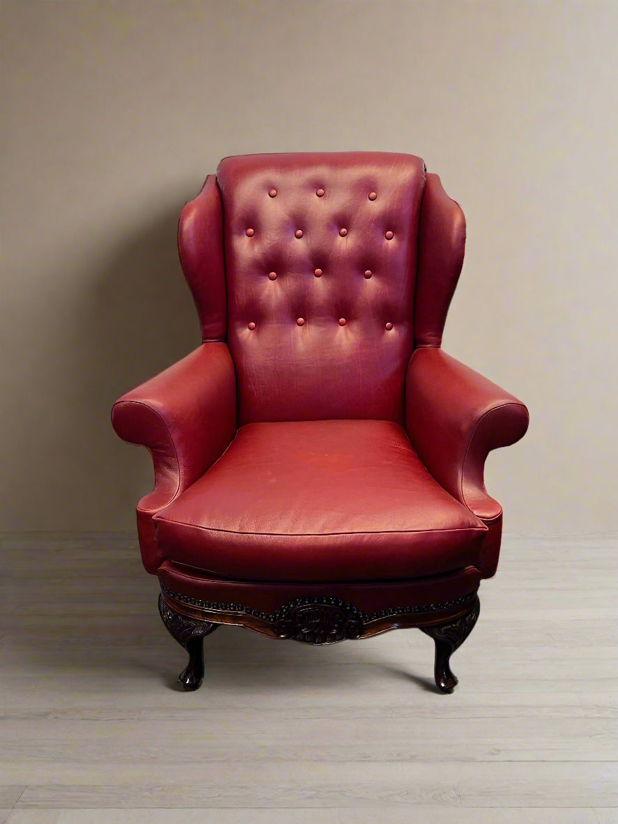 Elegant Vintage Burgundy Leather Wingback Chair with Minor Wear