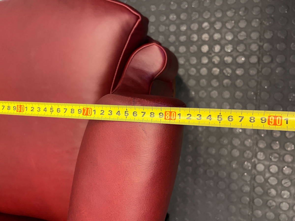 Elegant Vintage Burgundy Leather Wingback Chair with Minor Wear