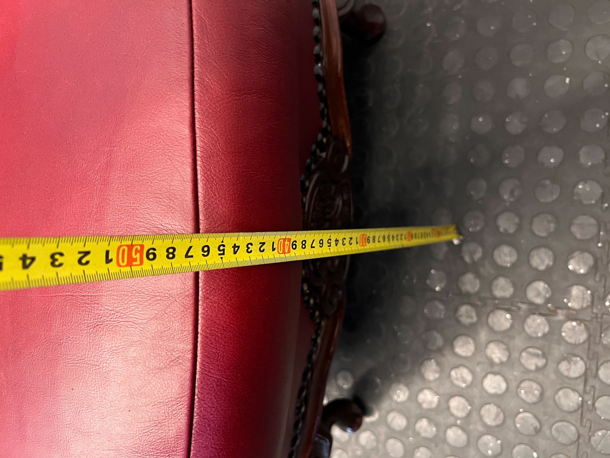 Elegant Vintage Burgundy Leather Wingback Chair with Minor Wear