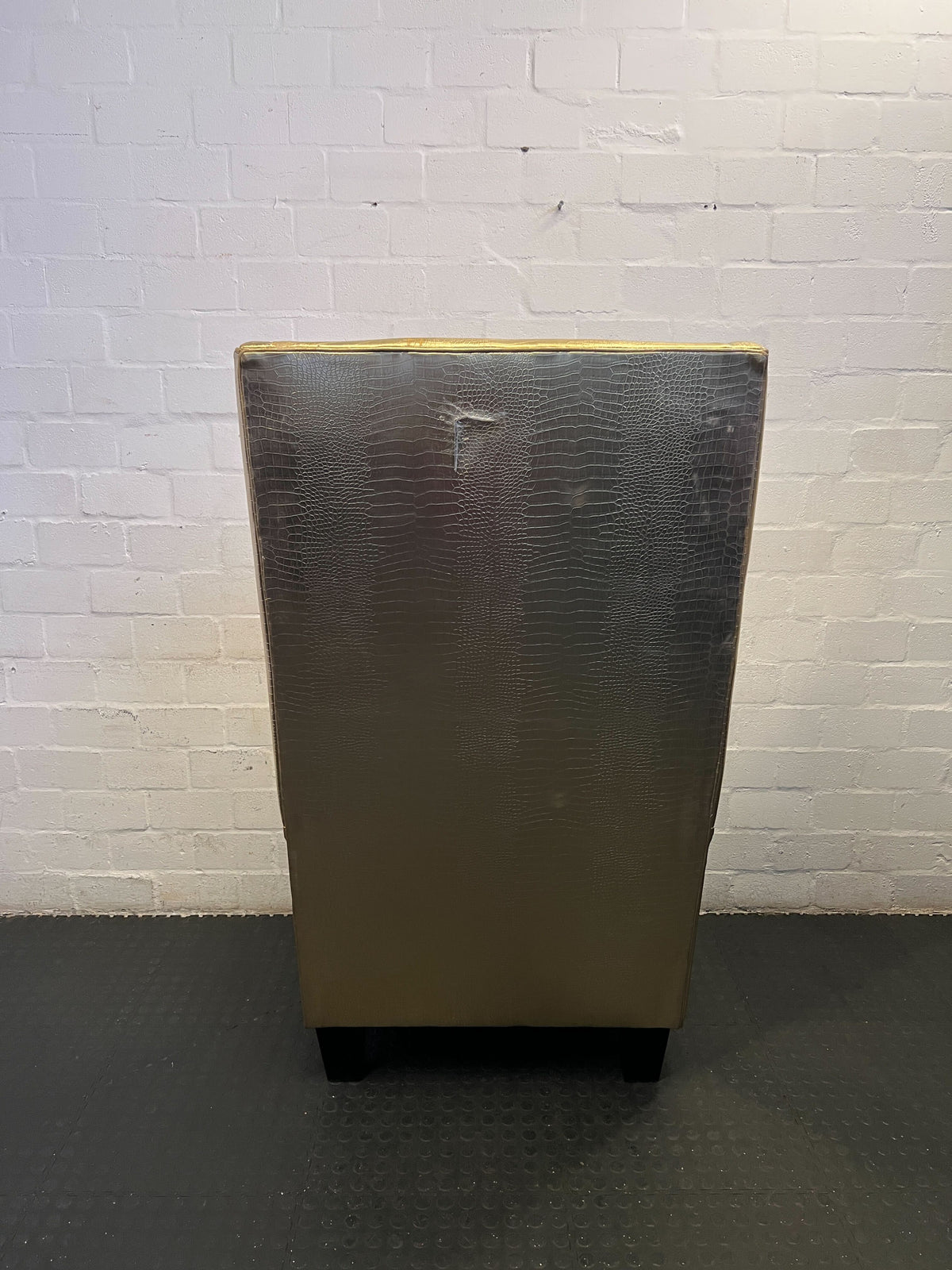 Glamorous Gold Faux Leather High-Back Armchair with Minor Wear