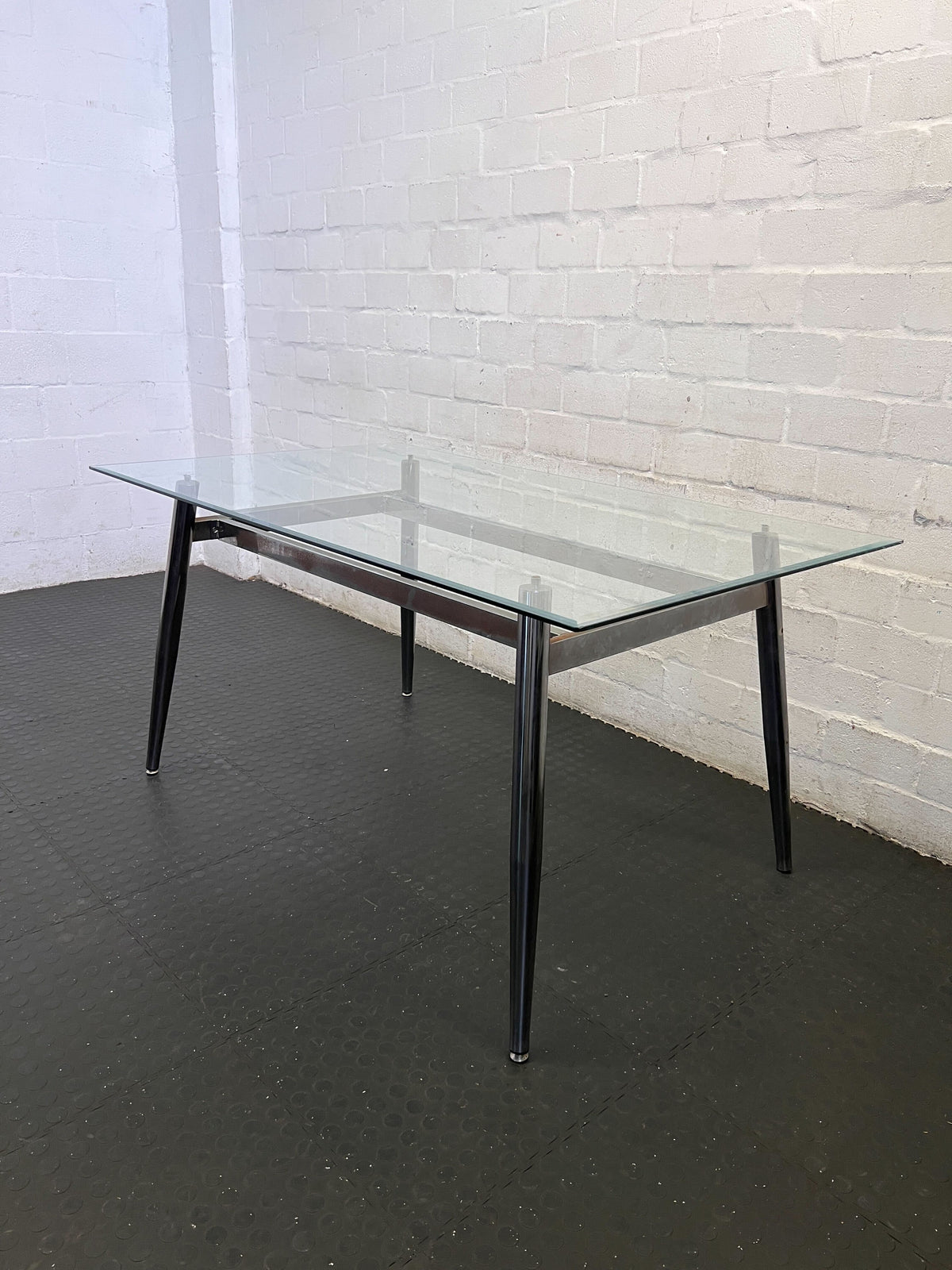 Sleek Glass & Metal Dining Table with Tapered Legs- Fair used